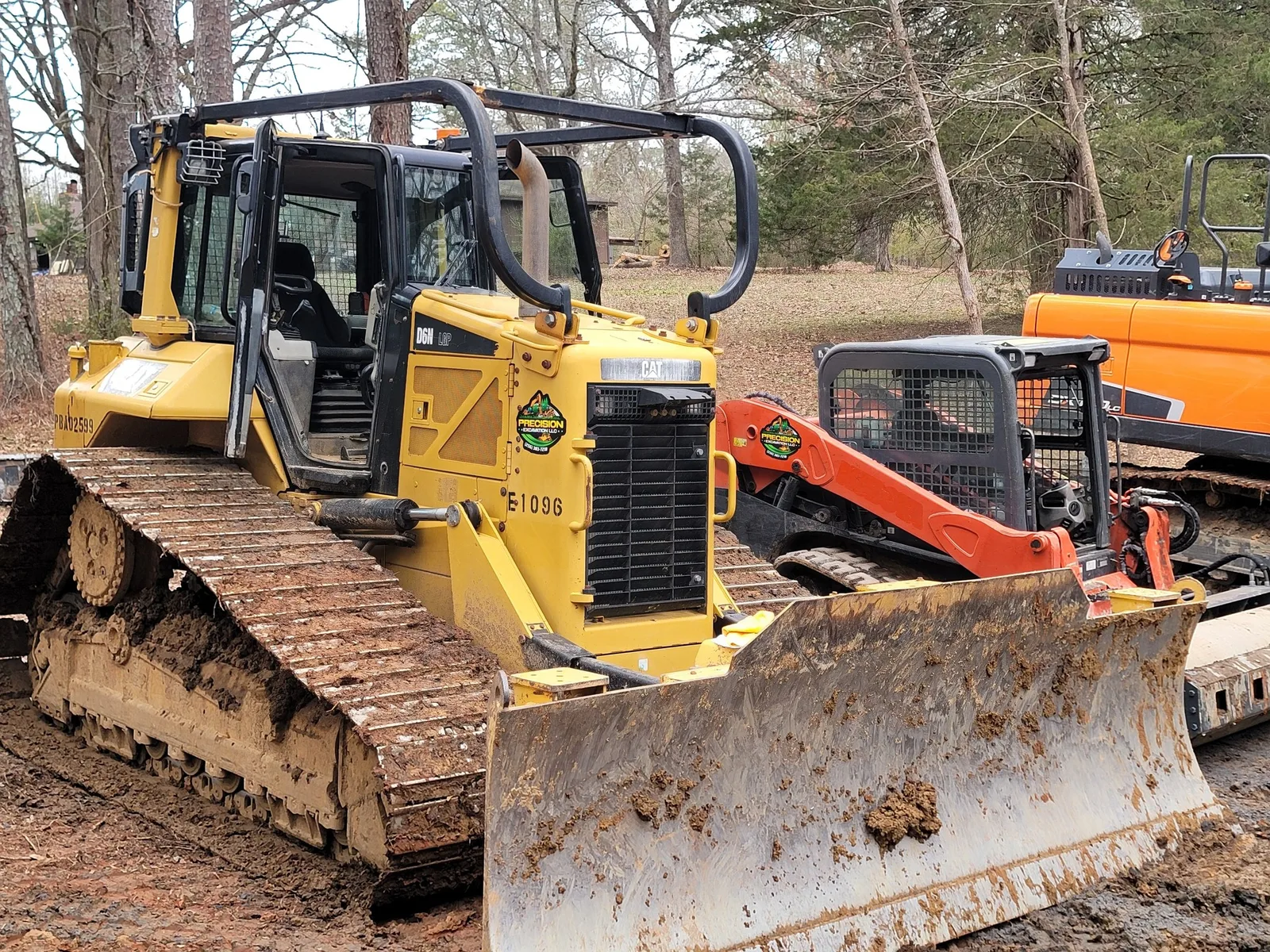 Our crawler dozer with the blade down on a job site