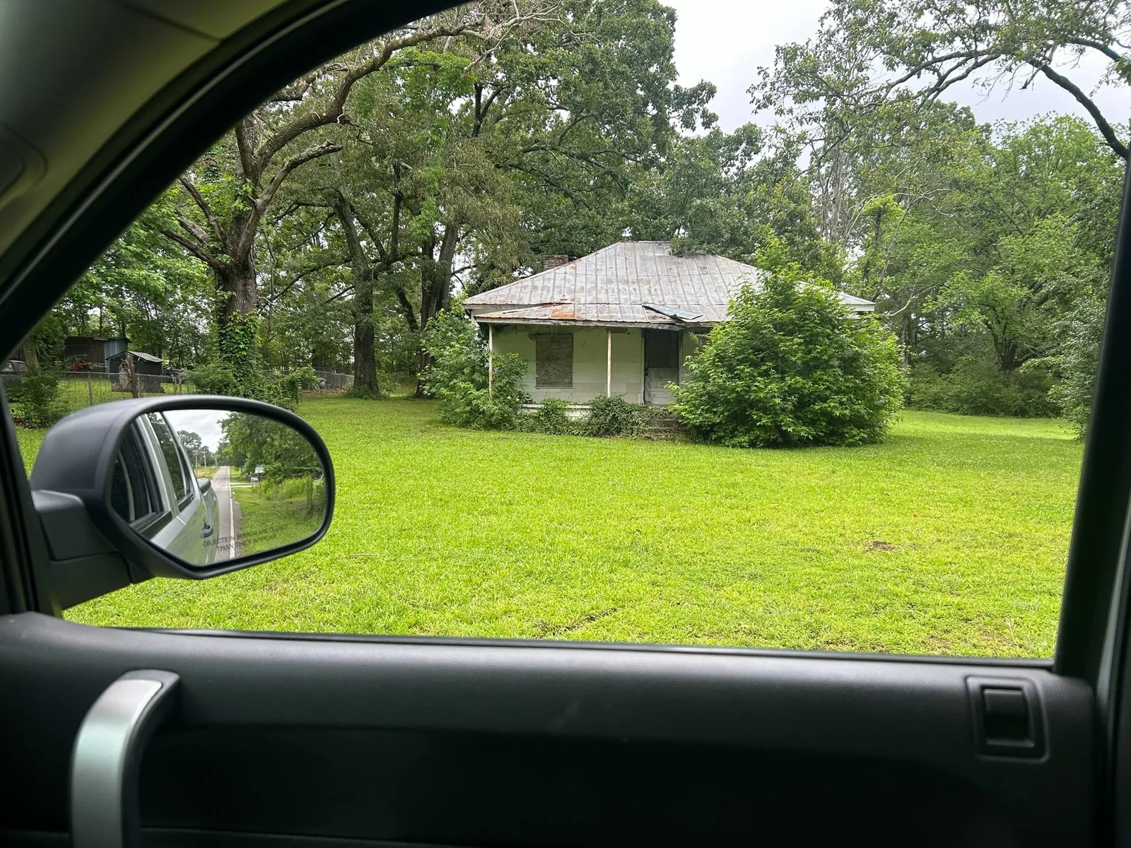 Small house among the trees before an eight hour teardown