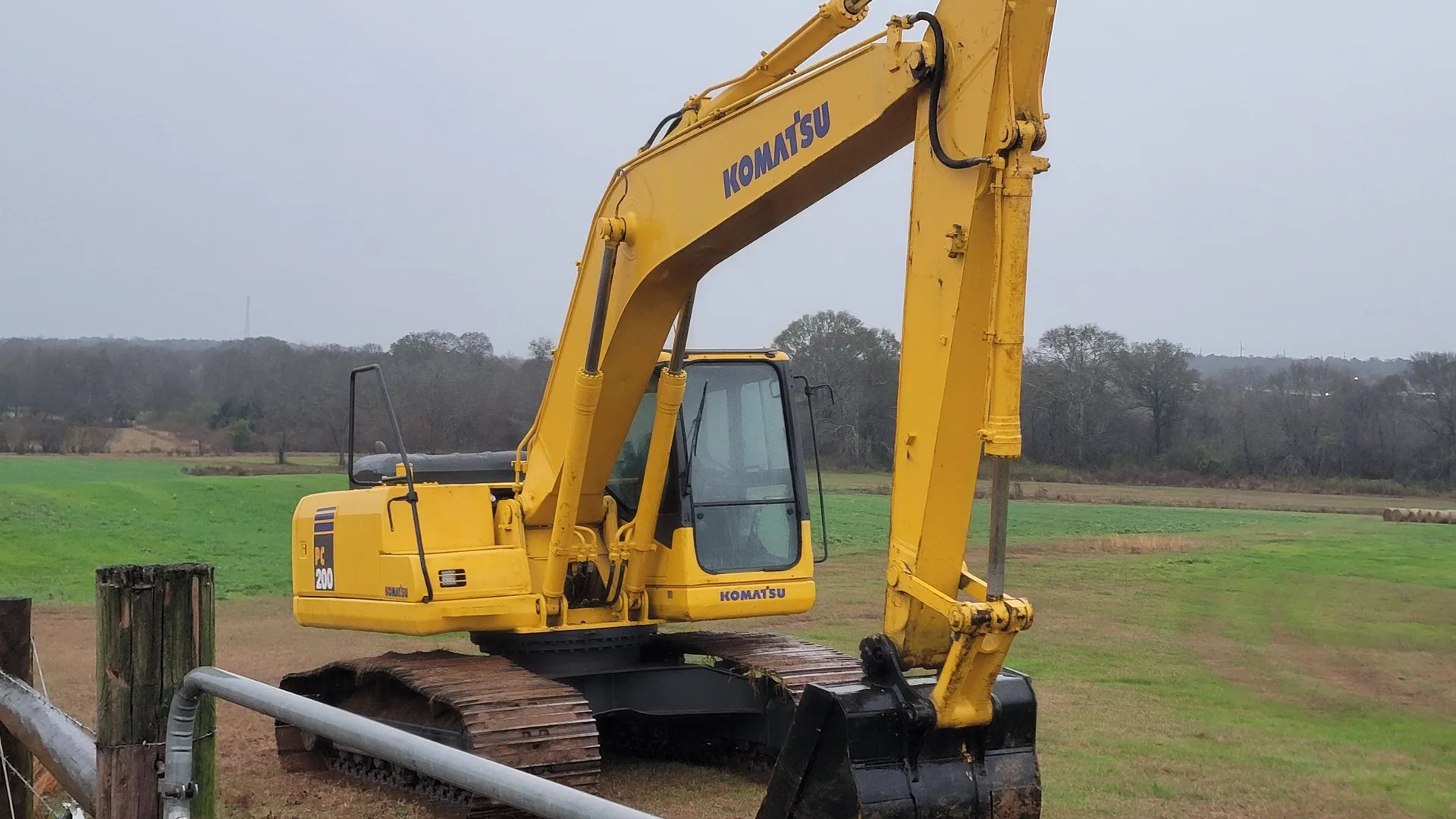 Trackhoe on a field job site