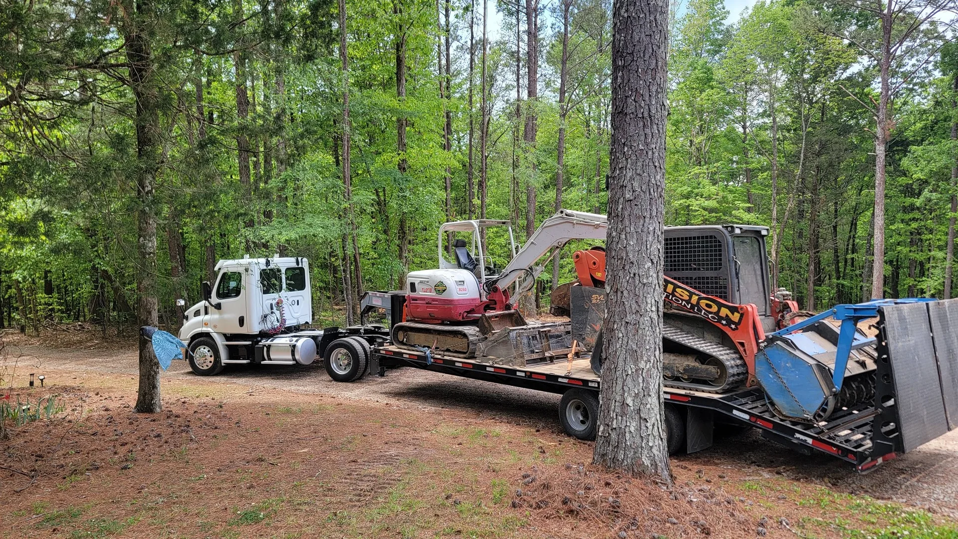 Trucks loaded with our machines heading to the next job